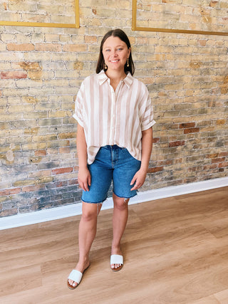 Woman wearing Mia Button Down T-Shirt – striped oversized cotton top