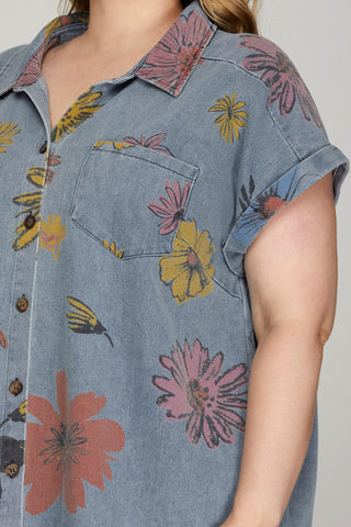 Plus size woman wearing floral denim shirt dress with pockets – summer outfit from Brightter Boutique.
