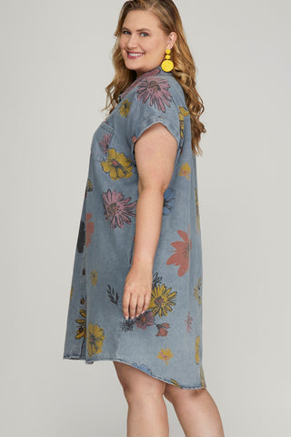 Plus size woman wearing floral denim shirt dress with pockets – summer outfit from Brightter Boutique.