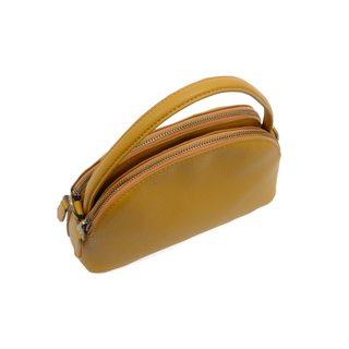 Side view of Larissa Crossbody handbag showing structured shape, top handle, and gleaming brass hardware. Mustard color.