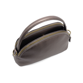 Side view of Larissa Crossbody handbag showing structured shape, top handle, and gleaming brass hardware. Metallic Bronze color.