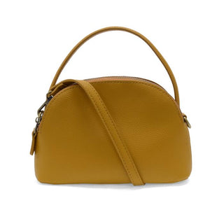 Larissa Crossbody by Joy Susan in rich pebble-grain vegan leather with brass zipper detail — available at Brightter Boutique. Mustard color.