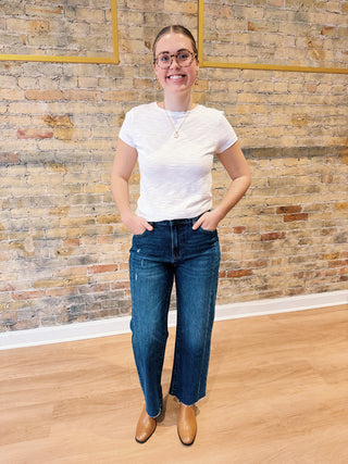 Relaxed straight leg jeans with vintage wash and distressing