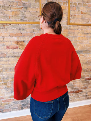 Back view of short red sweater for women