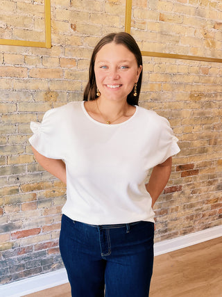 Everly Blouse – textured short sleeve top with elastic details on sleeves and flowy cut on the waist.