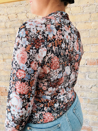 Close-up of floral detailing on the back and sleeves of the Rosa Top.