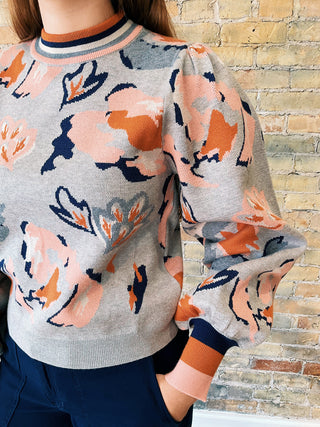 Close-up of Mirna Sweater showing floral knit pattern and striped ribbed neckline.