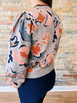 Side view of Mirna Sweater highlighting puff sleeve detail and colorful floral knit.