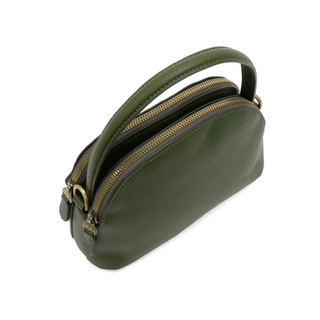 Side view of Larissa Crossbody handbag showing structured shape, top handle, and gleaming brass hardware. Olive color. 